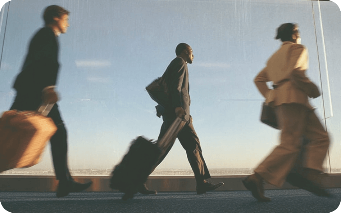 Corporate travelers with luggage